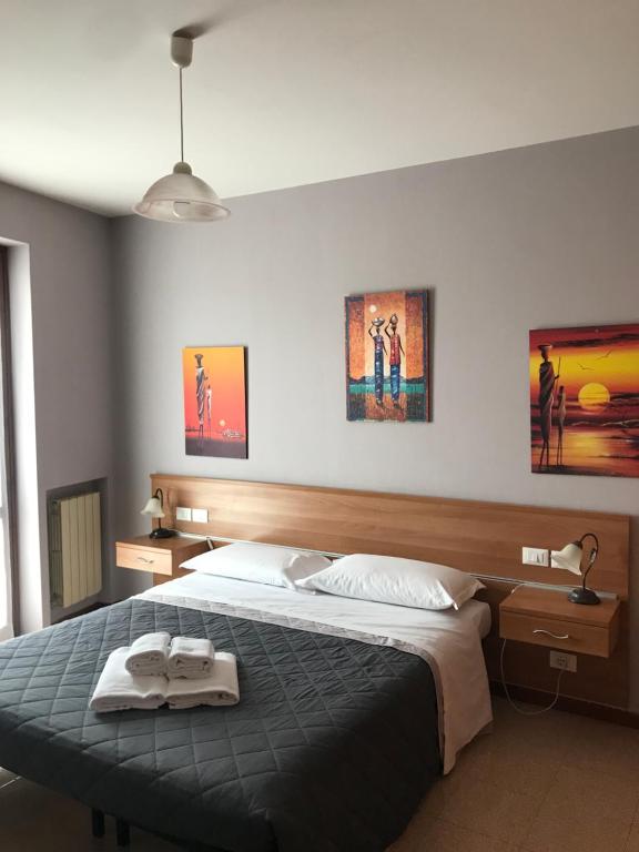 Postel nebo postele na pokoji v ubytování Camere Girasole