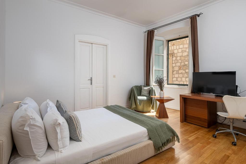 Posteľ alebo postele v izbe v ubytovaní Blasius Residence