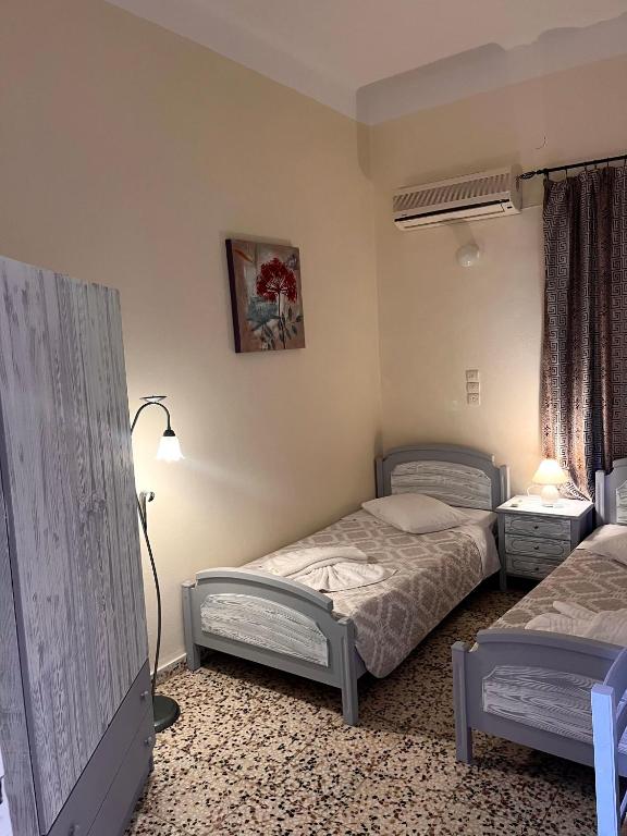 Postel nebo postele na pokoji v ubytování Alinda Hotel