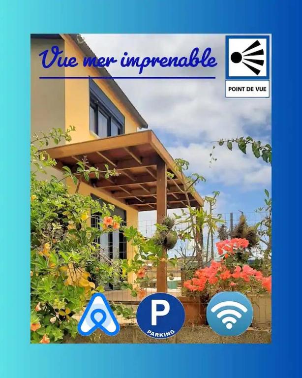 une photo d'une maison avec un membre d'aire imper appellate dans l'établissement NEW Joli Studio avec Vue mer imprenable - wifi, à Saint-Leu
