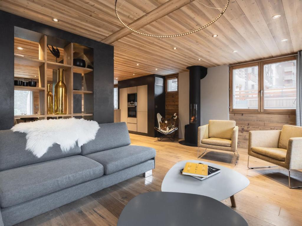 a living room with a couch and two chairs at Appartement La Clusaz, 4 pièces, 8 personnes - FR-1-304-176 in La Clusaz