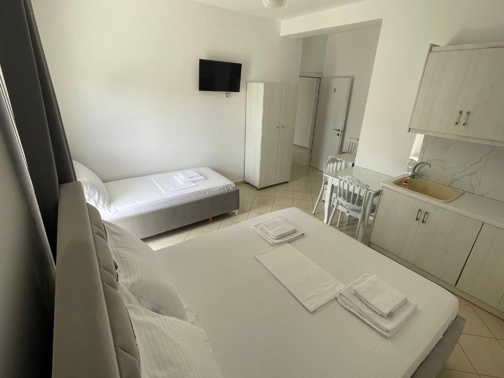 Posteľ alebo postele v izbe v ubytovaní Joni Apartments