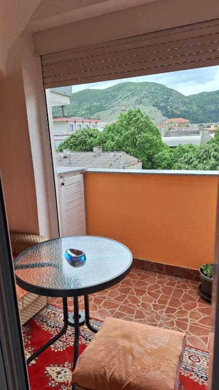a room with a table and a large window at Ana in Gradina