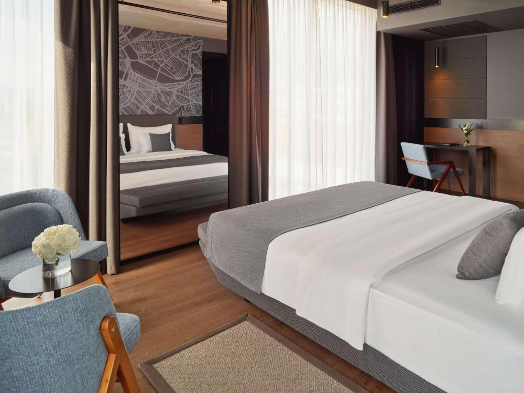 Postel nebo postele na pokoji v ubytování Mövenpick Zagreb
