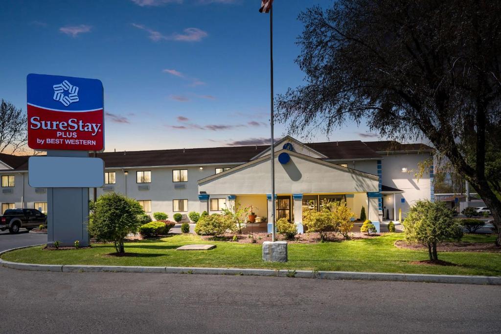 a resort building with a sign in front of it at SureStay Plus by Best Western Reading North in Reading