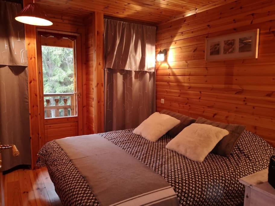 Ένα ή περισσότερα κρεβάτια σε δωμάτιο στο Chalet bois 45M2