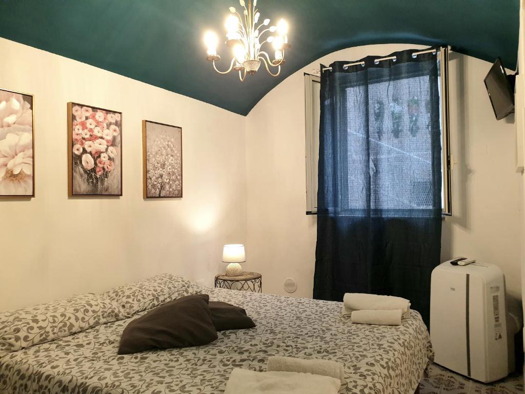 Postel nebo postele na pokoji v ubytování CasaRò (delizioso alloggio a Mondello)