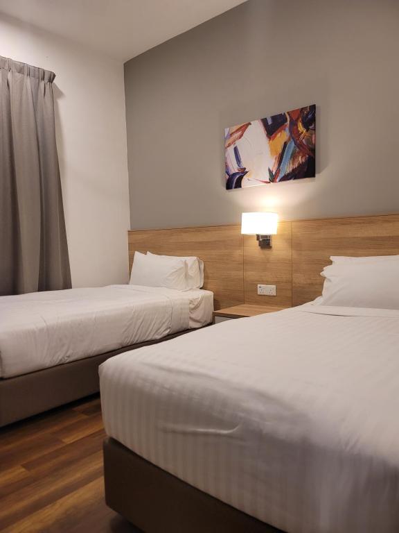 Postel nebo postele na pokoji v ubytování Doma House Onsen at Sunway Onsen, Tambun