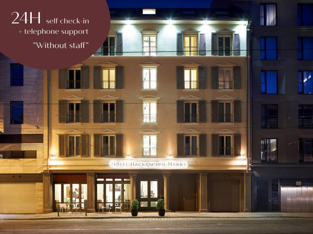 a building at night with the words self check in telephone support without staff at Classik Hotel Hackescher Markt - Limited Service in Berlin
