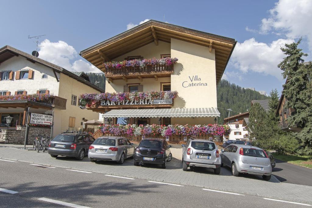 a group of cars parked in front of a building at Villa Caterina in Corvara in Badia