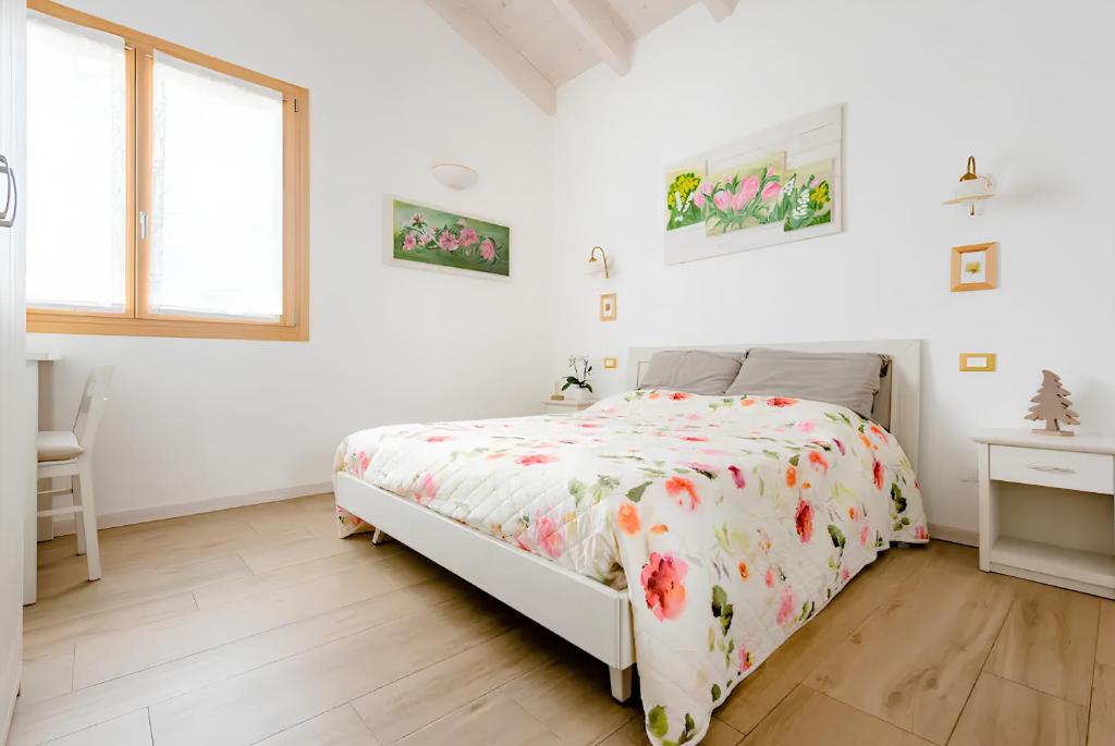 Un pat sau paturi într-o cameră la B&B Mimosa e Lillà