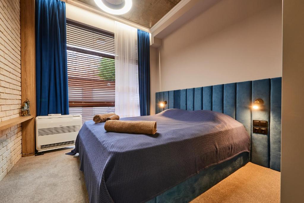 מיטה או מיטות בחדר ב-Florance Rentals Luxury Apartments in Burgas