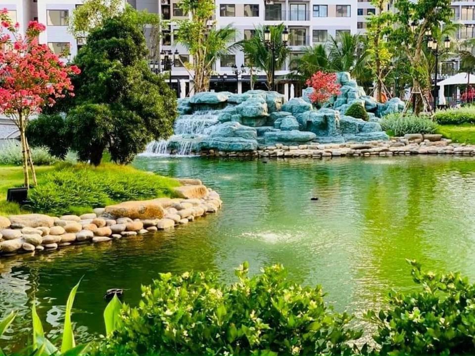 a river with a waterfall in a city at Resort Ori q9 3, giường, 2pn+ 2wc in Long Bình