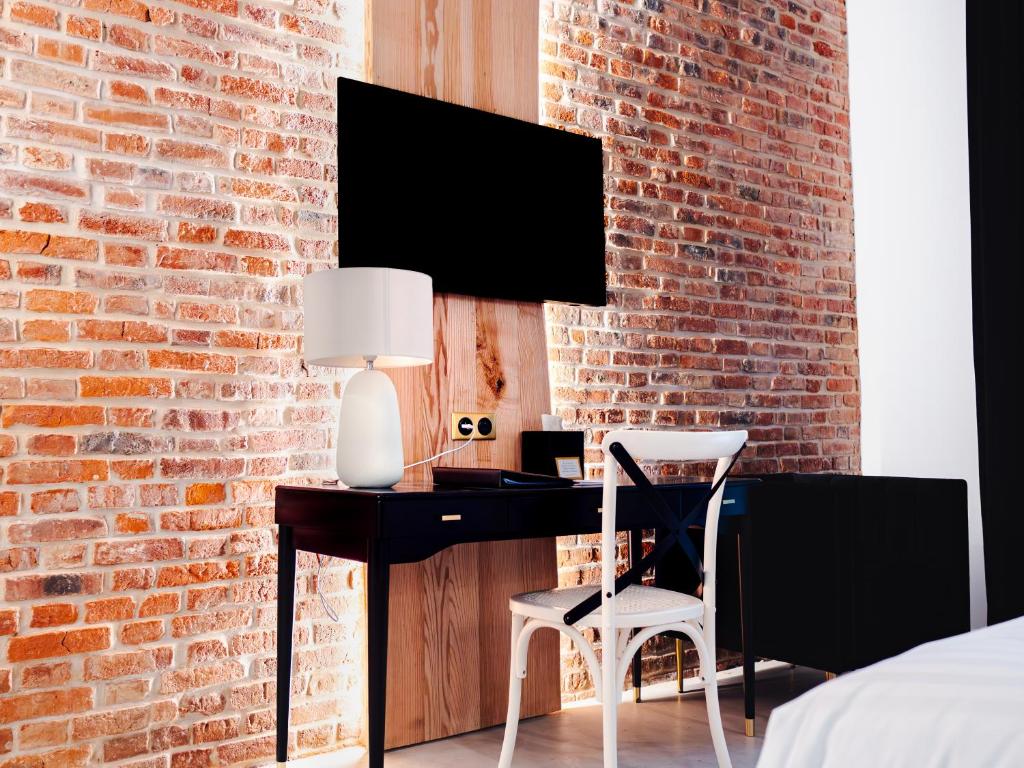 TV a/nebo společenská místnost v ubytování Hôtel Château Héloïse