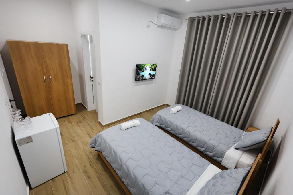 Postel nebo postele na pokoji v ubytování Guesthouse Aurel