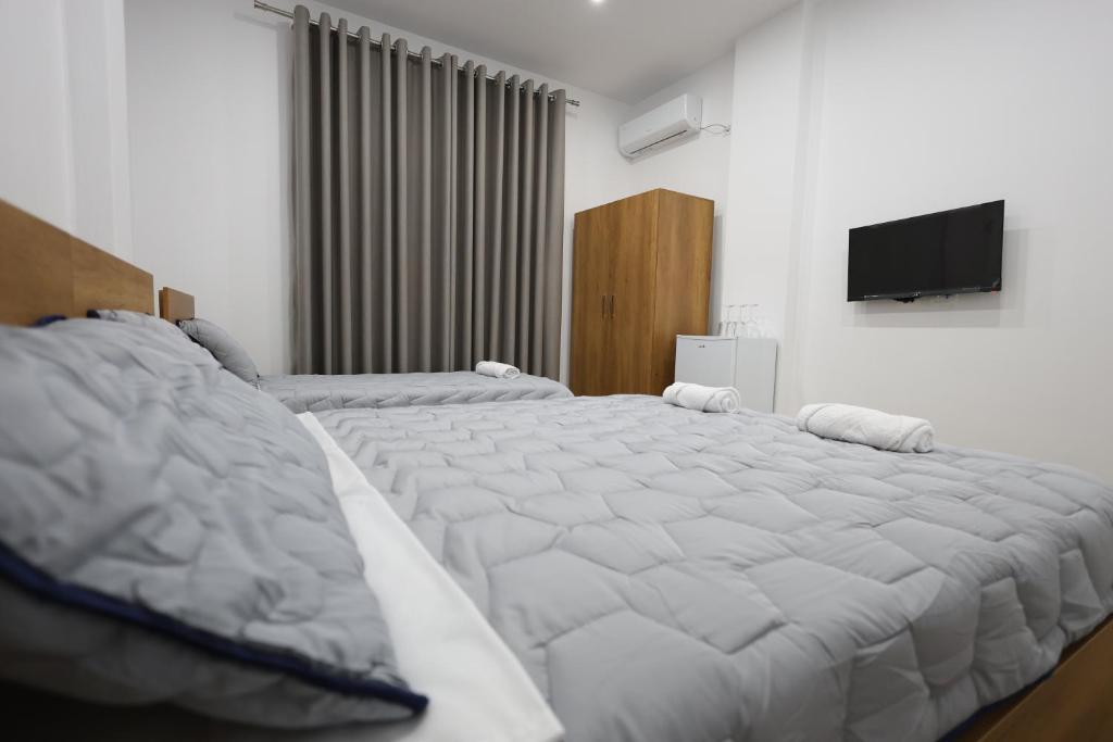 Postel nebo postele na pokoji v ubytování Guesthouse Aurel