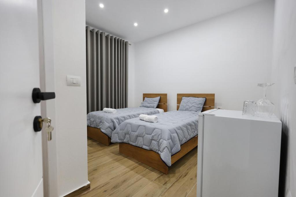 Postel nebo postele na pokoji v ubytování Guesthouse Aurel