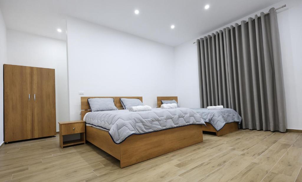 Postel nebo postele na pokoji v ubytování Guesthouse Aurel
