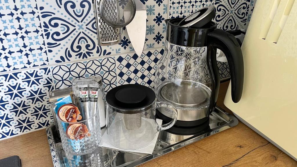 a kitchen counter with a coffee maker on a sink at Gdynia Riviera Hills in Gdynia