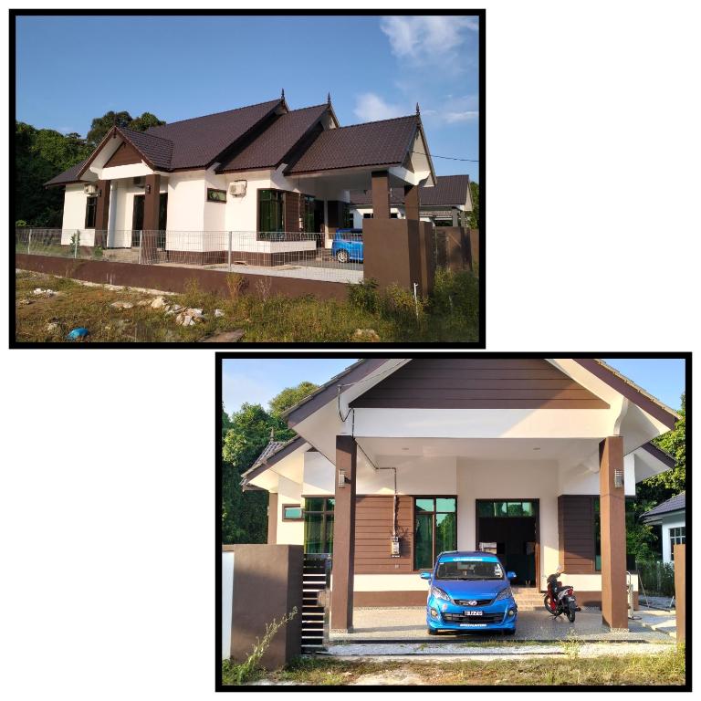 een huis met een auto ervoor geparkeerd bij Seri Zahra Homestay in Marang