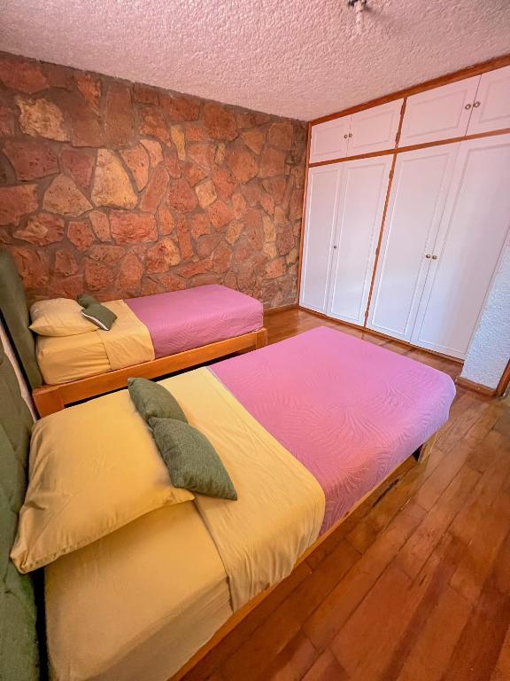 Postel nebo postele na pokoji v ubytování Hotel RJ Querétaro