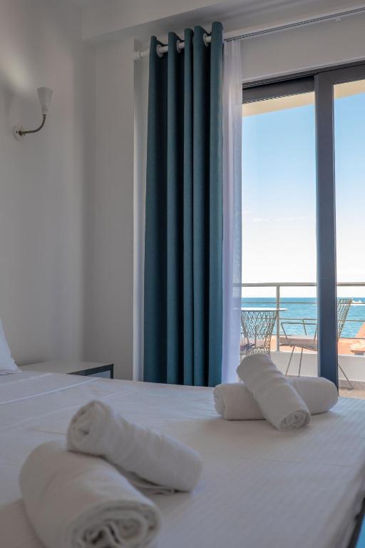 Postel nebo postele na pokoji v ubytování El Mare Hotel