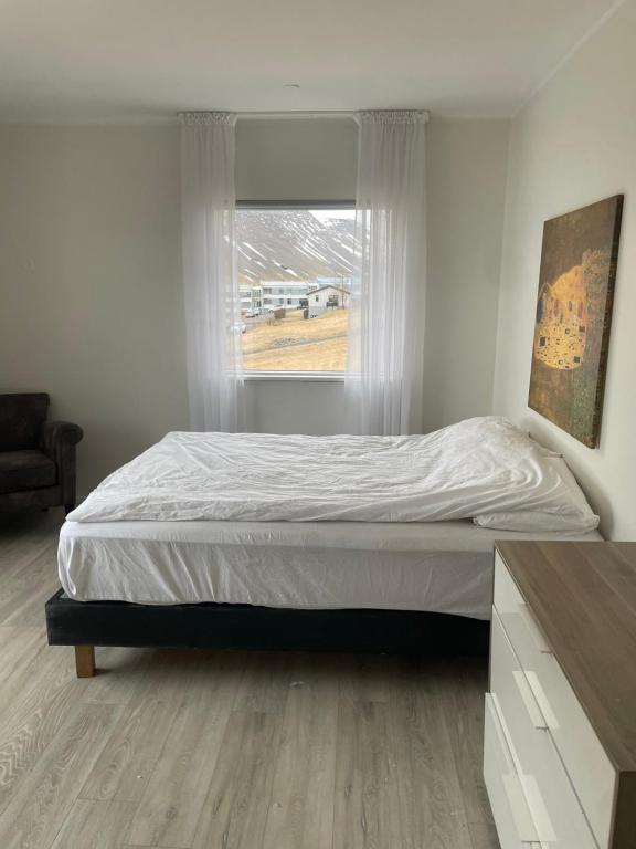 Postel nebo postele na pokoji v ubytování Sólgarður Guesthouse