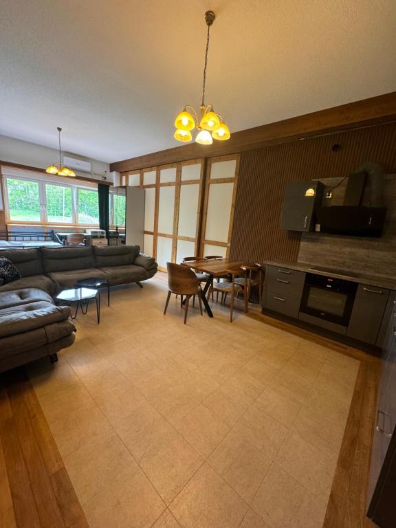 a living room with a couch and a table at Era Home Family in Murg
