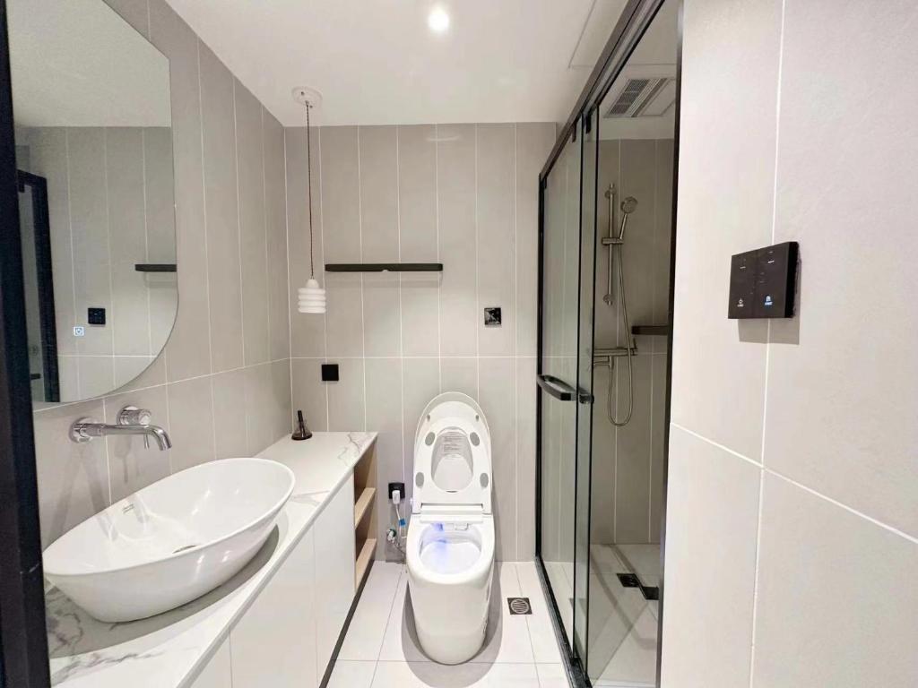 a bathroom with a toilet and a sink at 同济佳苑公寓 in Shanghai