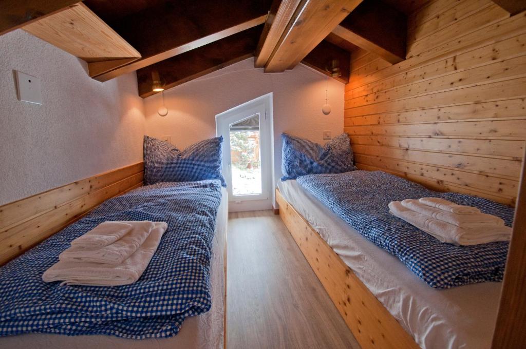 Postel nebo postele na pokoji v ubytování Haus Bodmen A, Studio Riffelsee