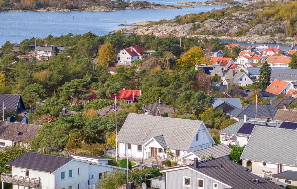 a town with houses on a hill next to the water at Awesome Home In Vstra Frlunda With Sauna in Västra Frölunda