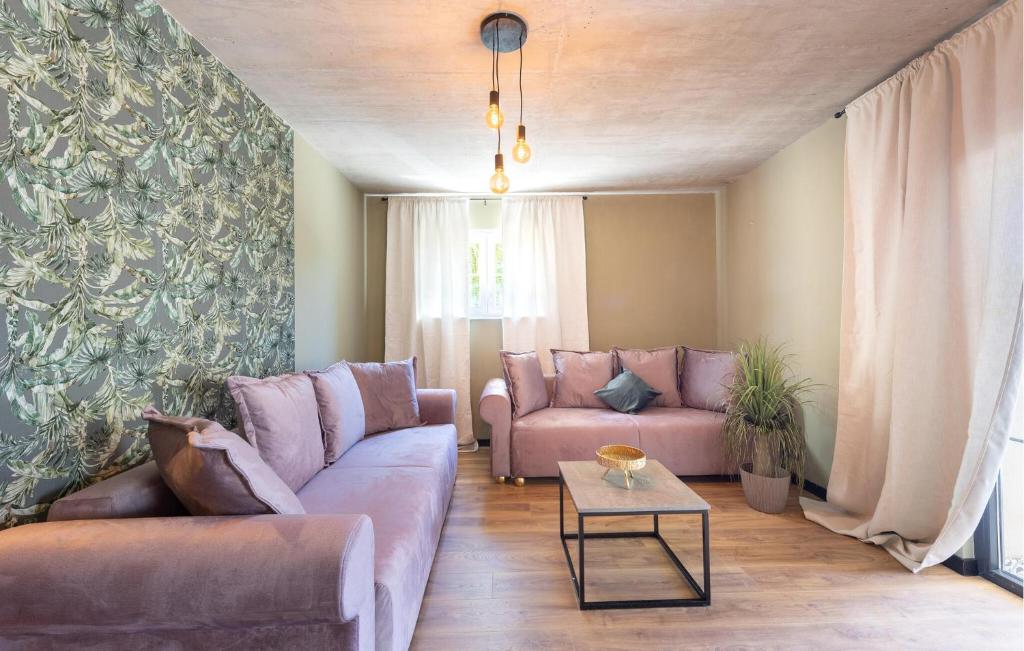 a living room with a couch and a table at Amazing Apartment In Podstrana With Wifi in Podstrana