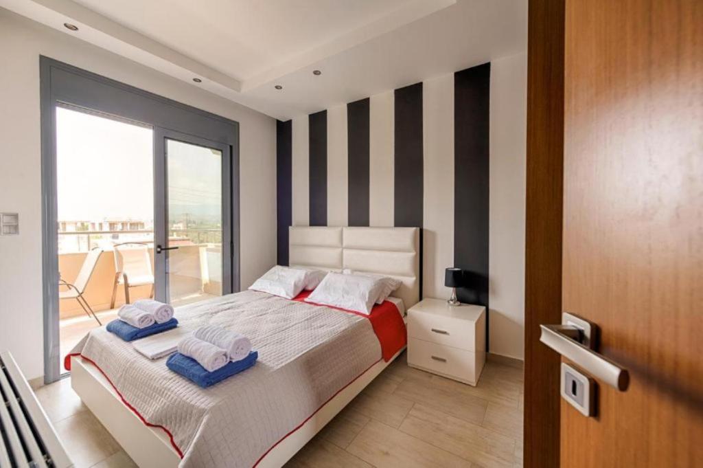 Postel nebo postele na pokoji v ubytování Villa Pandesia