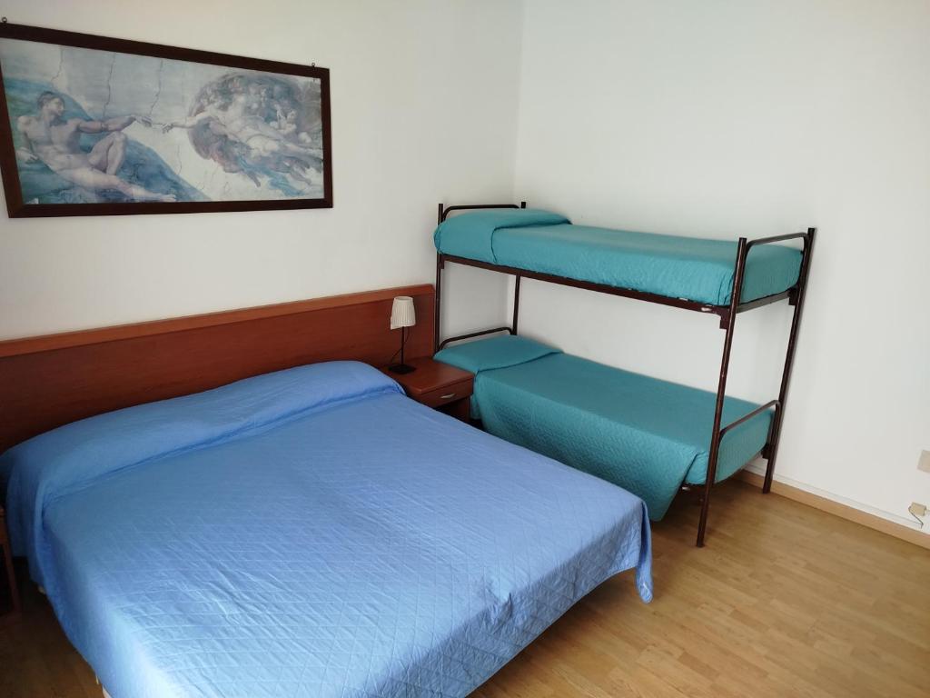 A bed or beds in a room at Hotel Silva Frontemare