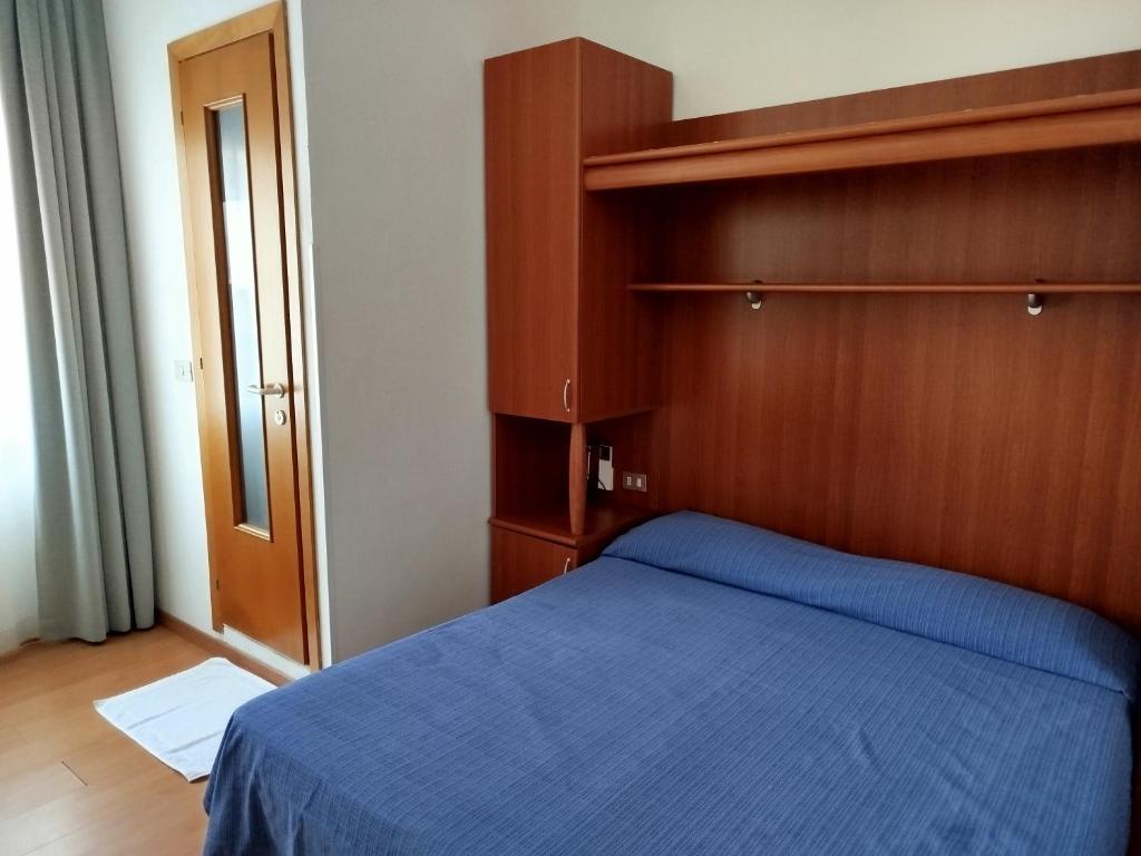 A bed or beds in a room at Hotel Silva Frontemare