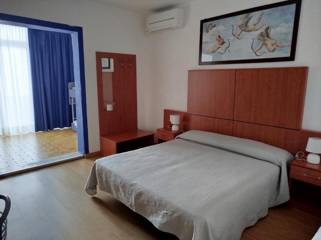 Postel nebo postele na pokoji v ubytování Hotel Silva Frontemare