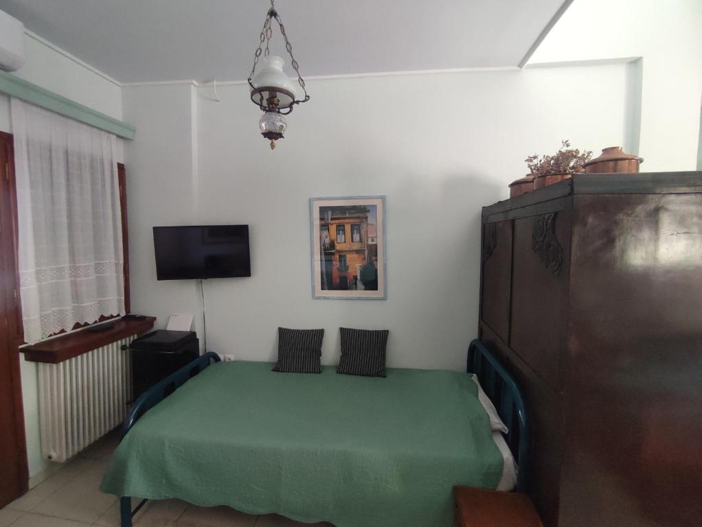 Postel nebo postele na pokoji v ubytování Ξενώνας Μυρτώ