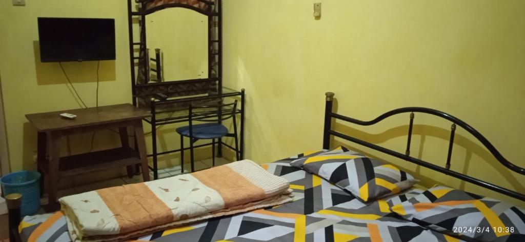 Postel nebo postele na pokoji v ubytování Istana Griya 1