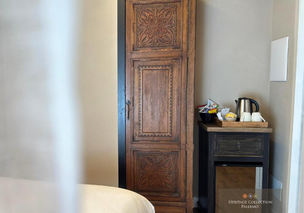 Postel nebo postele na pokoji v ubytování Heritage Collection Palermo B&B