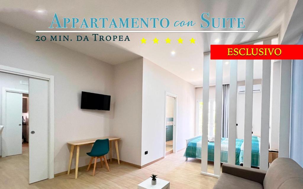 a room with a bed and a table and a couch at Blue Diamond in Vibo Valentia Marina