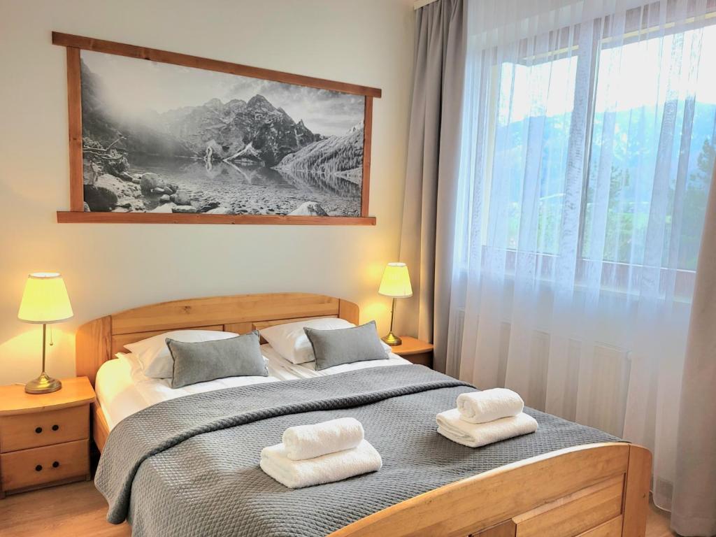 Posteľ alebo postele v izbe v ubytovaní Apartamenty Velvet