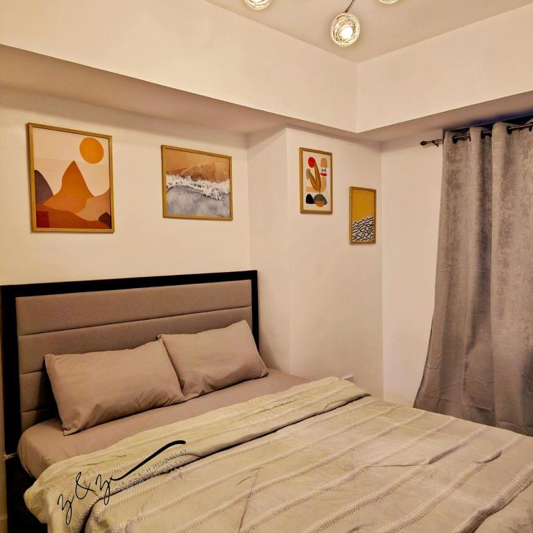 Postel nebo postele na pokoji v ubytování Zia and Zach Hideaway - Azure North Pampanga