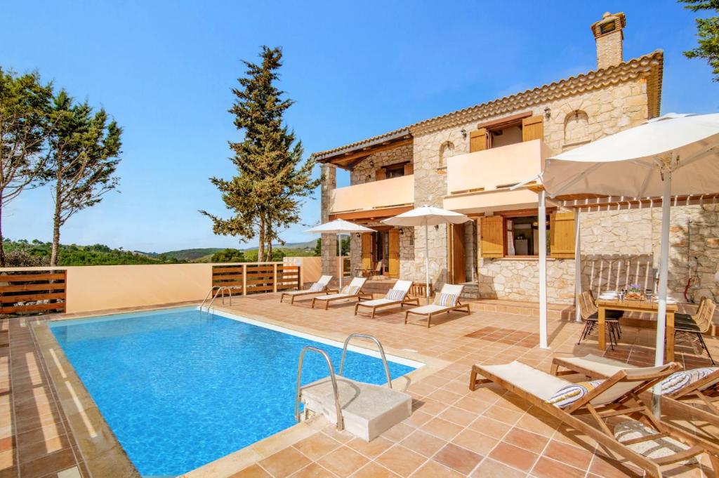 an image of a villa with a swimming pool at Villa Luciana by Villa Plus in Koiliomenos