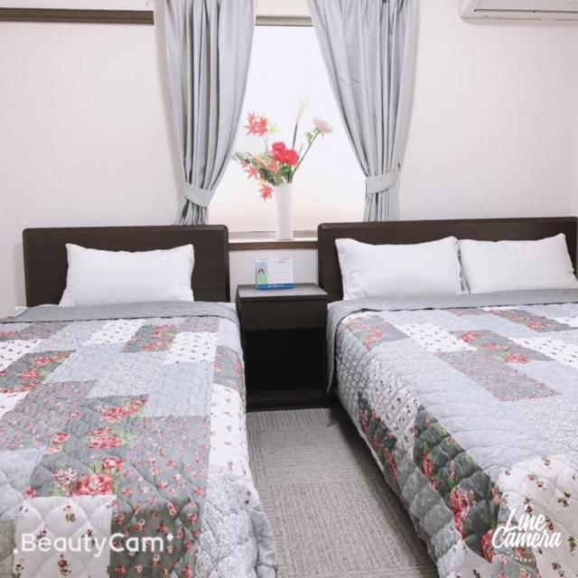 Postel nebo postele na pokoji v ubytování Ikebukuro Florence Hostel
