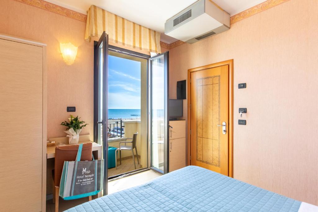 Postel nebo postele na pokoji v ubytování Hotel Metropole