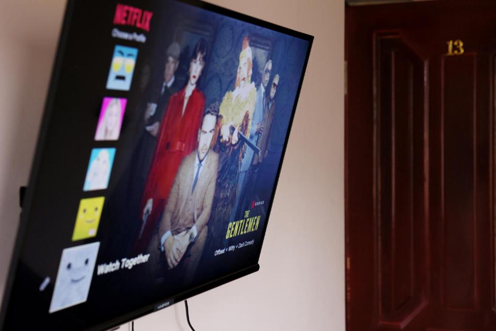TV a/nebo společenská místnost v ubytování Casanova Inn - Boutique Hotel