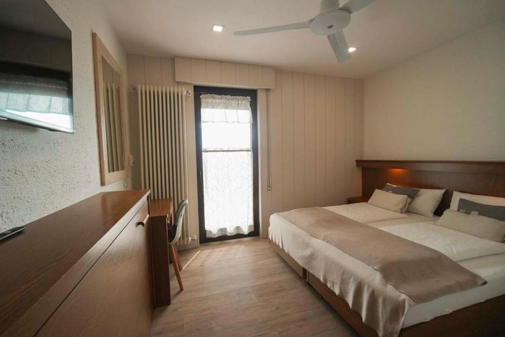 Postel nebo postele na pokoji v ubytování Albergo Deva