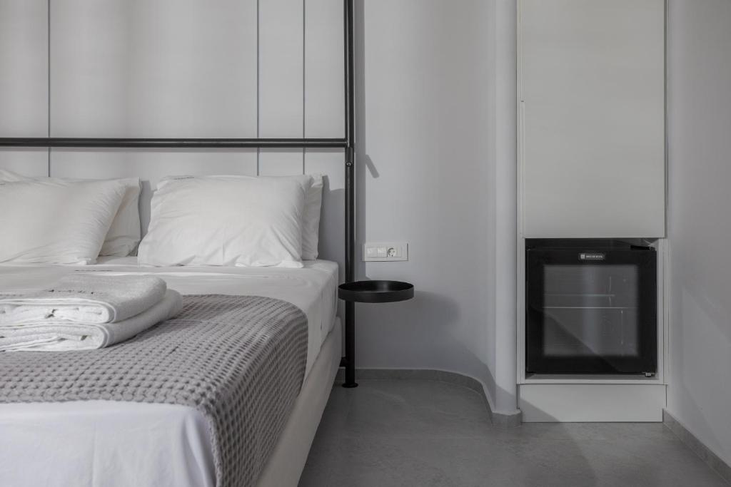 Postel nebo postele na pokoji v ubytování Basilico Suites Adults Only by Estia