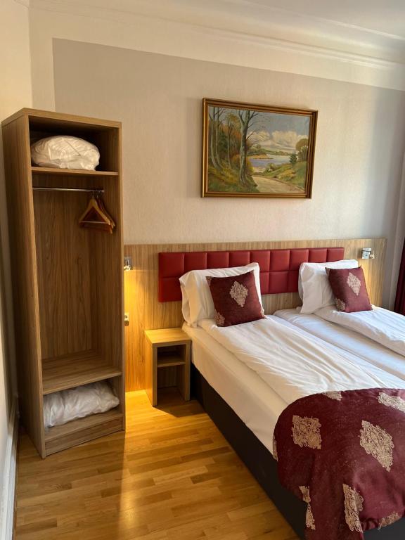 Postel nebo postele na pokoji v ubytování Hotel Skandia