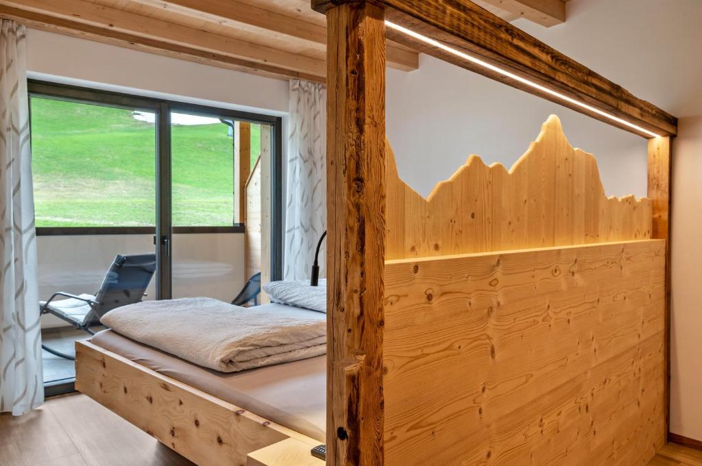 Postel nebo postele na pokoji v ubytování Blosegghof Bergchalets Waldblick